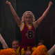 Sabrina Spellman in performing a cheer routine with some fellow youths.